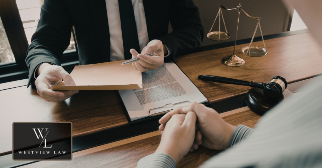 Employment lawyer reviewing workplace harassment evidence with client