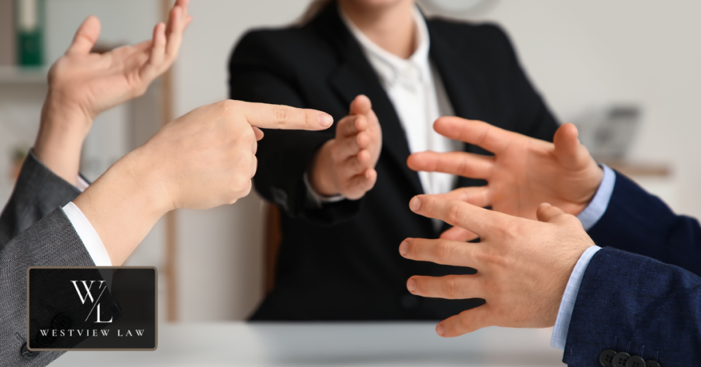 Workplace mediation meeting discussing harassment complaint resolution