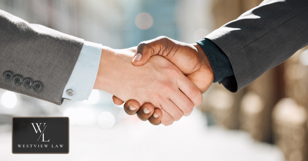 Employee and attorney reviewing settlement agreement after workplace harassment case