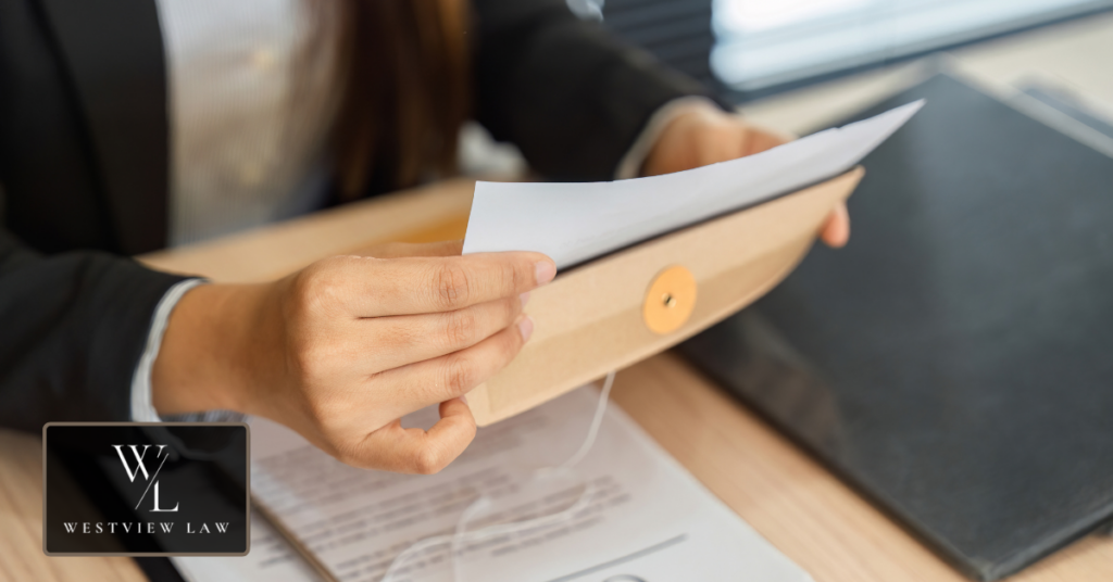 Employee reviewing records and preparing documents for an employment attorney