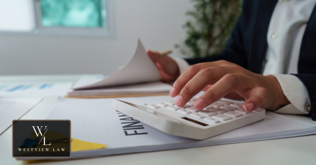 Professionals reviewing financial information related to an employment claim