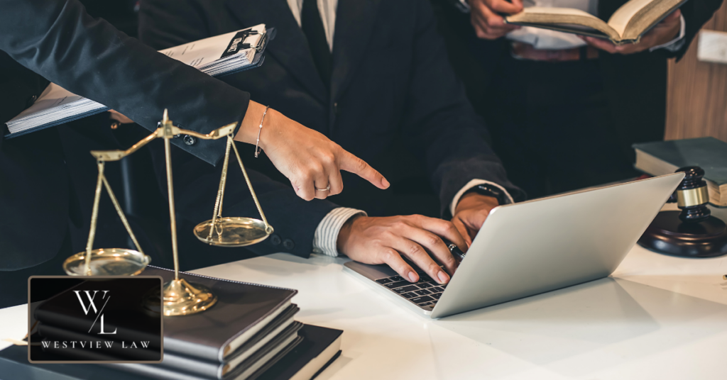 Employment attorney reviewing an FMLA leave case with scales of justice, representing legal support from Westview Law