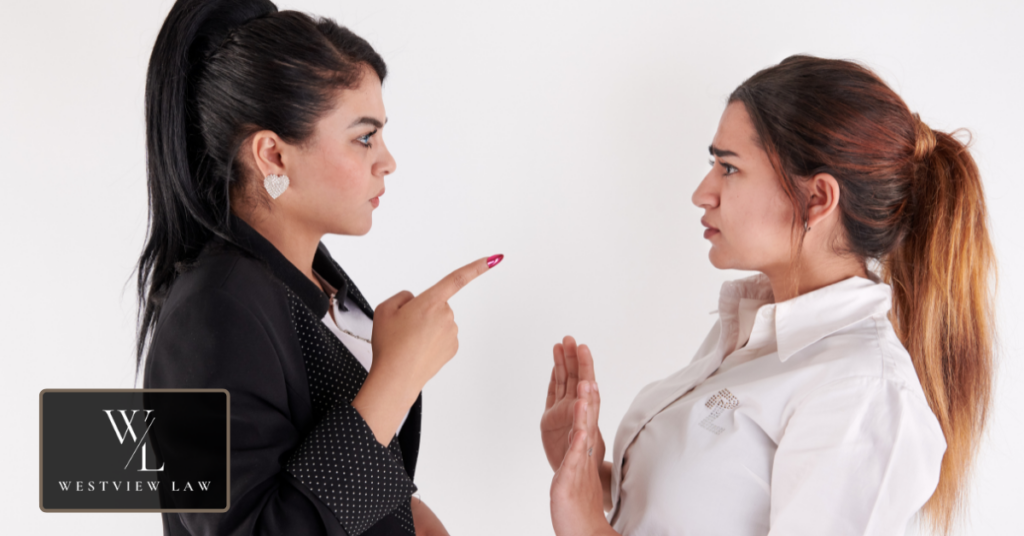 Workplace confrontation between two employees, illustrating common reasons for termination during FMLA leave